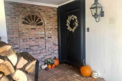 a room with pumpkins and a door with a brick wall at The Manor-Stunning Modern Farmhouse with Hot Tub in Dover