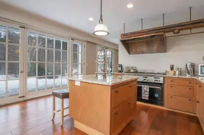 a large kitchen with a island in the middle of it at The Manor-Stunning Modern Farmhouse with Hot Tub in Dover