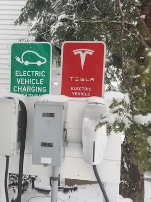 a couple of street signs in the snow at The Villa - Industrial Farmhouse with Hot Tub in Dover