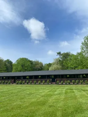 a building with a green field in front of it at The Willow, Catskill in Catskill