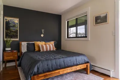 a bedroom with a bed and a window at The Willow, Catskill in Catskill