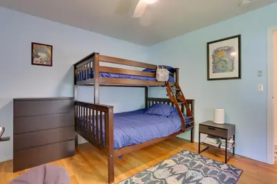 a bedroom with a bunk bed with purple sheets at Woodstock Getaway with Hot Tub about 2 Mi to Dtwn! in Woodstock