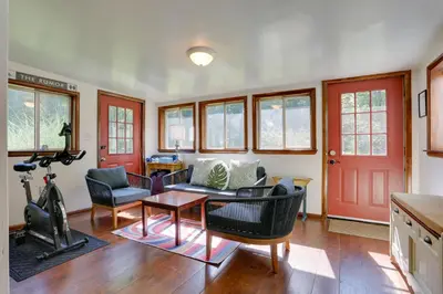 a living room with a couch and a table at Woodstock Getaway with Hot Tub about 2 Mi to Dtwn! in Woodstock