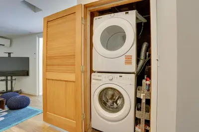 a washer and dryer in a room at Woodstock Getaway with Hot Tub about 2 Mi to Dtwn! in Woodstock
