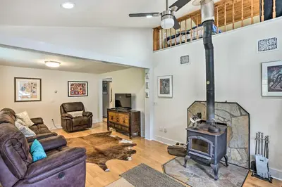 a living room with a fireplace and a couch at Jewett Gem with Charcoal Grill and Mountain Views in Jewett