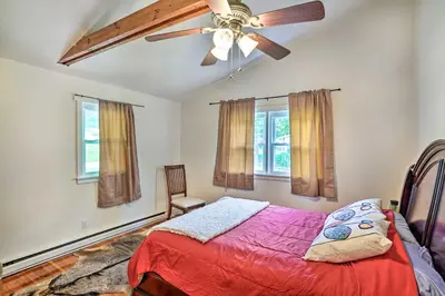 a bedroom with a ceiling fan and a bed at Jewett Gem with Charcoal Grill and Mountain Views in Jewett