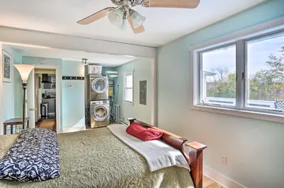 a bedroom with a bed with a fan and a window at Jewett Gem with Charcoal Grill and Mountain Views in Jewett
