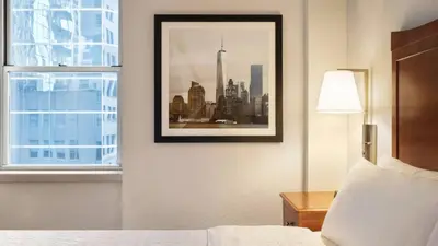 a hotel room with a picture of a city at Hampton Inn Manhattan/Downtown- Financial District in New York