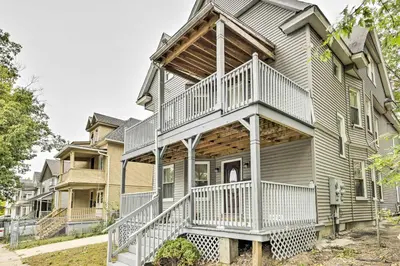a house with a wrap around porch at 2 Mi to Downtown Springfield Apt with Balcony! in Springfield