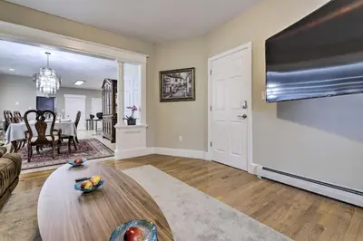 a living room with a couch and a table at 2 Mi to Downtown Springfield Apt with Balcony! in Springfield