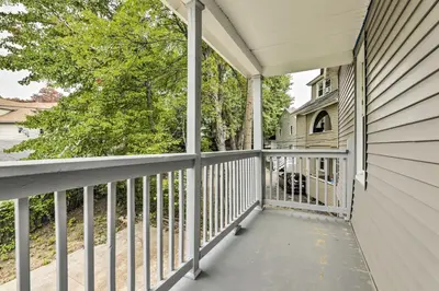 a balcony with a view of a house at 2 Mi to Downtown Springfield Apt with Balcony! in Springfield