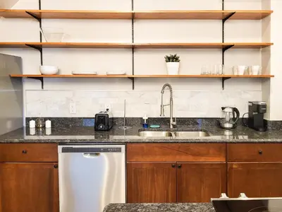 a kitchen with a sink and a dishwasher at Beautiful Wooster Sq. getaway - great neighborhood in New Haven