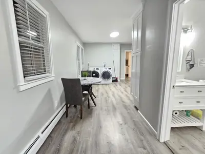 a dining room with a table and a microwave at 1 Bedroom Apartment in Hartford