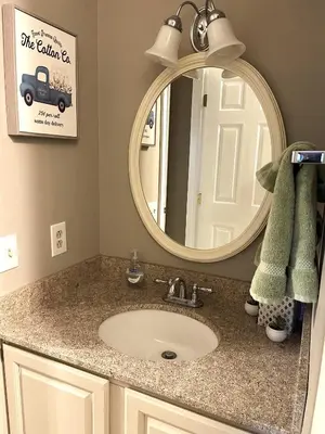 a bathroom with a sink and a mirror at Ski On Off 1BR Suite 1st Flr Sleeps 4 Jiminy Peak in Hancock
