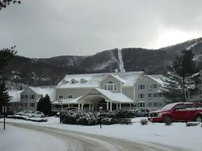 a large house with snow on the roof at Spacious 3BR 3BA Sleeps 8 Ski On Off Jiminy Mountain Resort in Hancock