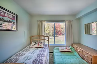 a bedroom with a bed and a window at Comfortable Dover Apartment Walk to Mt Snow! in Dover