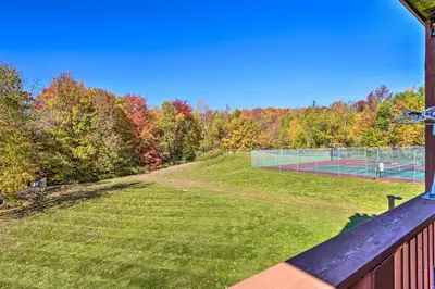 a tennis court with a fence and a tennis court at Comfortable Dover Apartment Walk to Mt Snow! in Dover