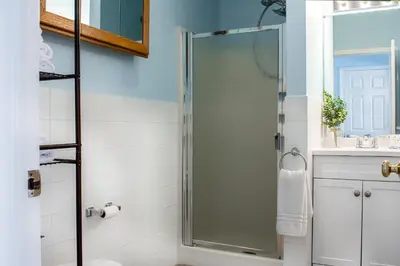 a bathroom with a shower with a glass door at Cozy condo with yard and patio. Long-stay discount available in Fairfield