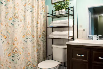 a bathroom with a toilet and a sink at Cozy condo with yard and patio. Long-stay discount available in Fairfield