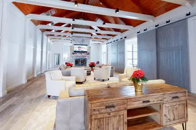 a living room with white furniture and a fireplace at All Season Mountain Retreat in Dover