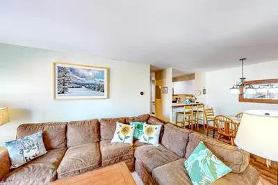 a living room with a couch and a table at All Season Mountain Retreat in Dover
