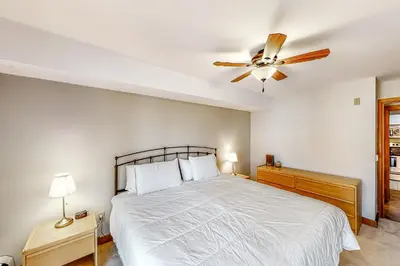 a bedroom with a bed and a ceiling fan at All Season Mountain Retreat in Dover