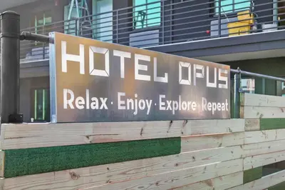 a sign for ailditzelielielielieliagencyagencyagencyemetery istg at Hotel OPUS Bronx Near Bay Plaza Mall in Bronx