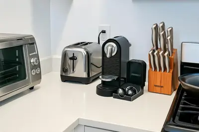 a kitchen counter with a toaster and a toaster oven at Modern Studio with Private Bathroom and Kitchen in New York
