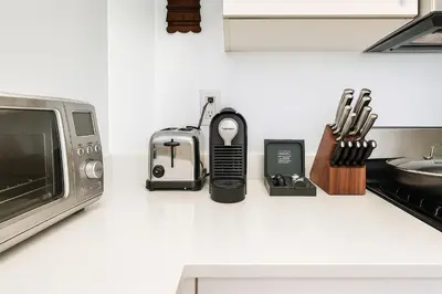 a kitchen counter with a toaster and a microwave at Modern Studio with Private Bathroom and Kitchen in New York