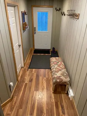 a room with a door and a dog bed in it at Mandy's Mountain Chalet in Dover