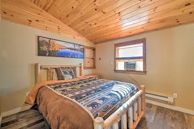 a bedroom with a bed and a wooden ceiling at Unadilla Cabin on 50 Acres and Fire Pit and Creek in Unadilla