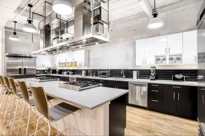 a large kitchen with a large white counter top at Trumbull Apartments Hartford CT in Hartford