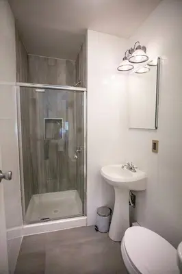 a bathroom with a shower and a toilet and a sink at 1 Mile to Hunter Mt! Cozy 3 Bedroom in Hunter