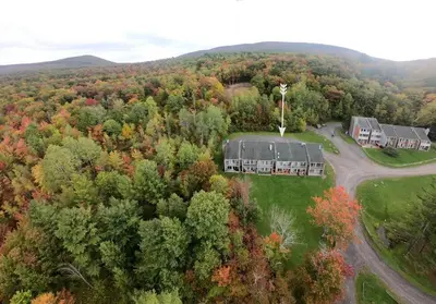 an aerial view of a house in the forest at 1 Mile to Hunter Mt! Cozy 3 Bedroom in Hunter