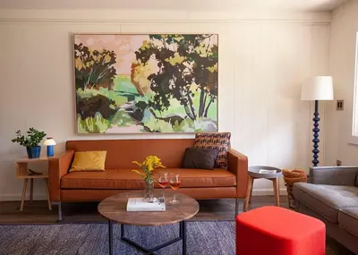 a living room with a couch and a table at 1 Mile to Hunter Mt! Cozy 3 Bedroom in Hunter