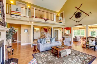 a living room with a couch and a table at Bovina Mountain High in Bovina Center