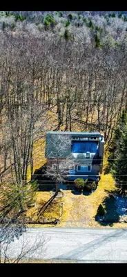 a bus parked on the side of a road at Pocono House in a private community 4 pools, Lake. in Tobyhanna