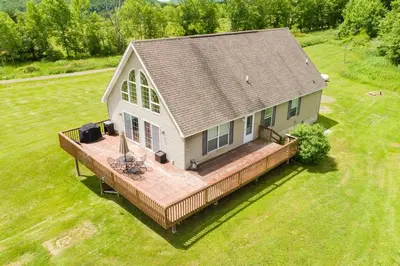 an aerial view of a house with a large deck at Bluestone Hill House in Walton