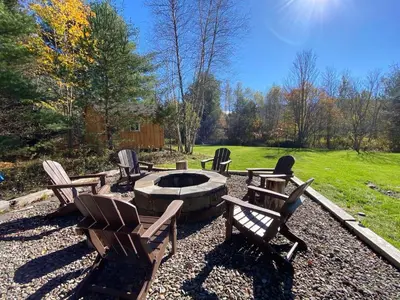 a group of chairs sitting around a fire pit at Hunter Mountain Sanctuary in Hunter