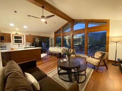 a living room with a couch and a table at Hunter Mountain Sanctuary in Hunter