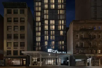 a building with a sign in front of it at Aloft New York Chelsea in New York