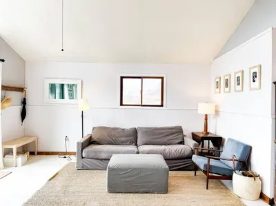 a living room with a couch and a table at Hamden Hill House in Hamden