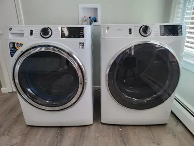 two washing machines are sitting next to each other at One room for rent shared bathroom and kitchen in Hartford