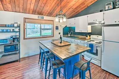 a kitchen with a large wooden table and chairs at Cozy Catskills Escape, 3 Mi to Plattekill Mtn in Roxbury