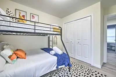 a bedroom with a bunk bed and a door at Community Beach and Lake Pocono Summit Escape in Pocono Summit