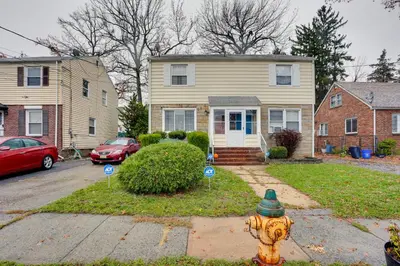 a fire hydrant in front of a house at Newark Home with Deck and Fire Pit, 16 Mi to NYC! in Newark