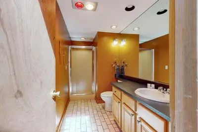 a bathroom with a toilet and a sink at Suntec Getaway in Dover