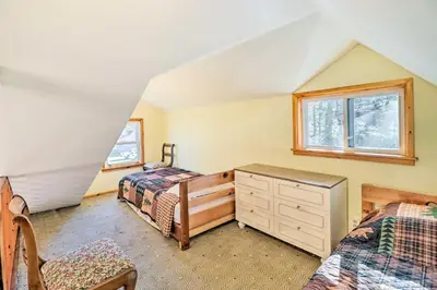 a bedroom with two beds and a dresser and a window at Cozy Tannersville Gem - Ski, Hike, Explore! in Tannersville
