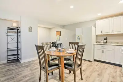 a kitchen and dining room with a table and chairs at Charming Beacon Apt with Fire Pit Near Hiking! in Beacon