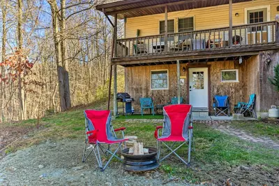 a group of chairs sitting in front of a house at Charming Beacon Apt with Fire Pit Near Hiking! in Beacon